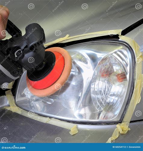 Car Light Repairing Hand With Tool Polish Headlight Stock Photo