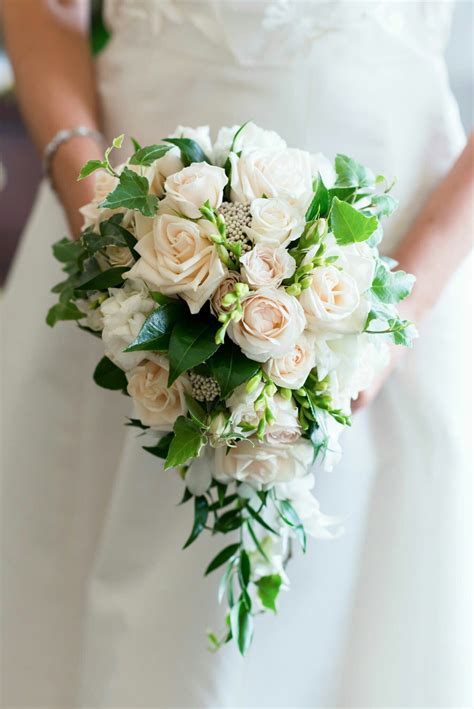Elegant Teardrop Bridal Bouquet Showcasing White Freesia White Roses