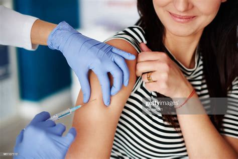 Woman Receiving An Injection In Her Arm Photo Getty Images
