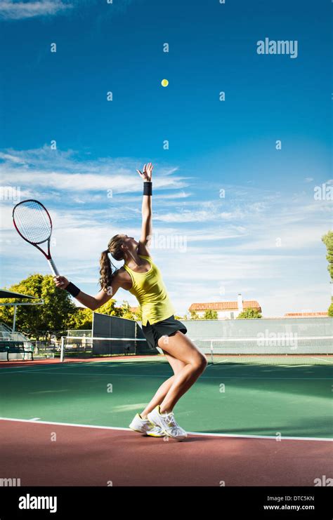 Female Tennis Player Hitting Ball Stock Photo Alamy