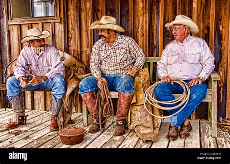 The Cowboy Life In The Usa West As Cowboys Relax And Talk On Old Stock