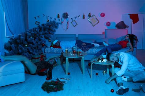 Drunk Friends Sleeping In Messy Room After New Year Stock Photo Image