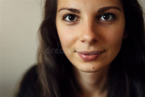 Portrait Of A Beautiful Young Caucasian Woman Smiling With Big Black