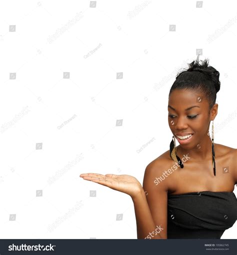 A Lovely Young Black Hostess Holding Her Right Hand Out Palm Up