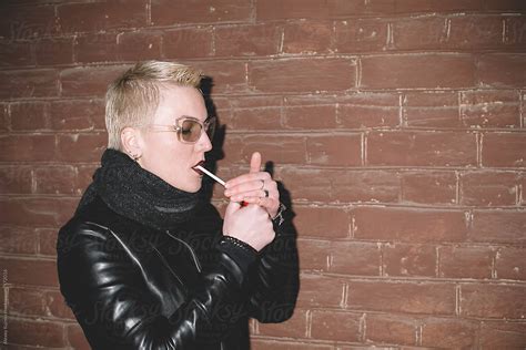 Lesbian Woman Lighting Cigarette By Alexey Kuzma