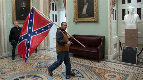 Man Photographed With Confederate Flag During Capitol Riot Arrested