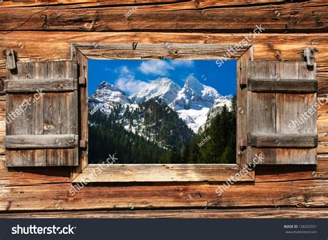 View Through A Wooden Window On A Mountain Panorama With Forest In