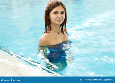 Portrait Of A Fit Babe Woman In The Swimming Pool Happy Smiling