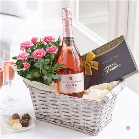 Our gorgeous feminine hampers are filled with the traditional favourites, chocolate and champagne or contemporary sensual treats like scented. Luxury Sparkling Rose Wine Gift Basket