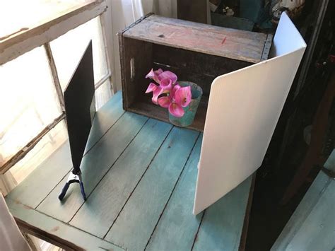 An Open Laptop Computer Sitting On Top Of A Wooden Table Next To A