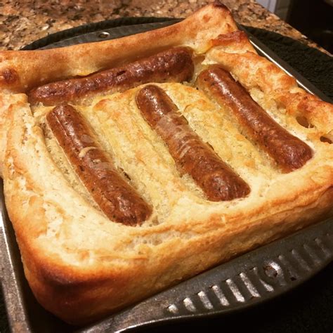 Pour the dripping or vegetable oil into a large metal roasting tin. Vegan toad in the hole : vegan