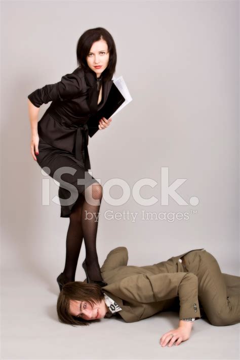 Business Woman And Chief Under A Heel Stock Photo Royalty Free