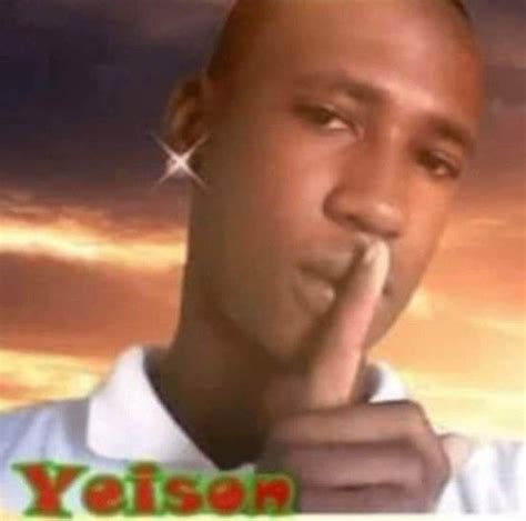 A Man Is Holding His Finger To His Mouth With The Words Yolan On It