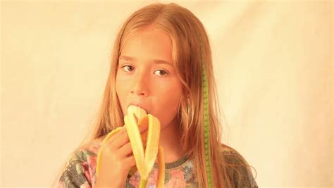 Cute Girl Eating Banana Stock Footage Video 100 Royalty Free 11321498 Shutterstock