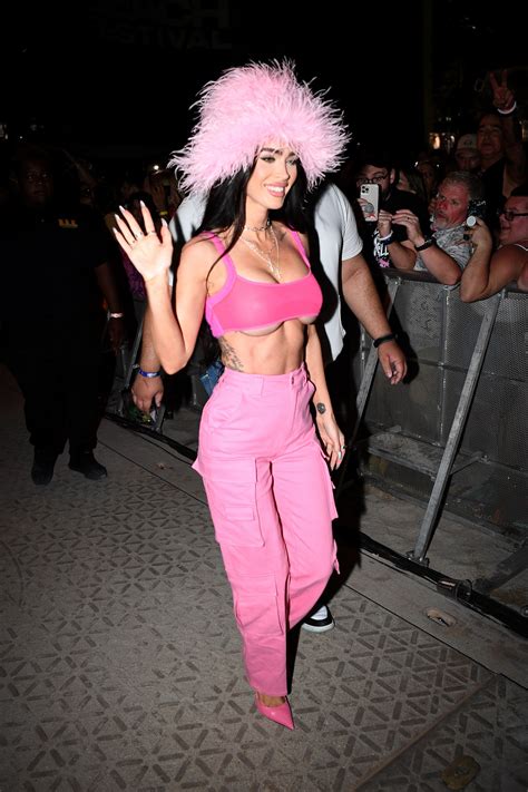 Megan Fox Wore An Underboob Baring Crop Top And A Pink Feather Hat To