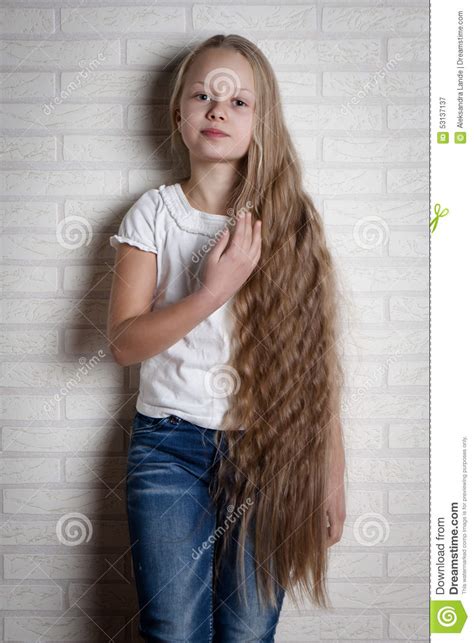 Caucasian little girl with long blond hair, in a beautiful pink. Beautiful Little Girl With Long Hair Stock Image - Image ...
