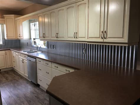 A metal kitchen backsplash is all the rage these days and it's not hard to understand why. Corrugated Steel Backsplash www.arlel.ca | Steel ...