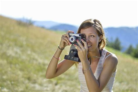 Young And Beautiful Woman Holding A Retro Camera Stock Photo Image Of