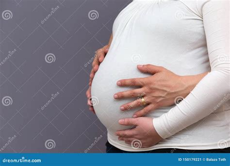 Expectant Parents Holding Growing Baby Bump Stock Image Image Of