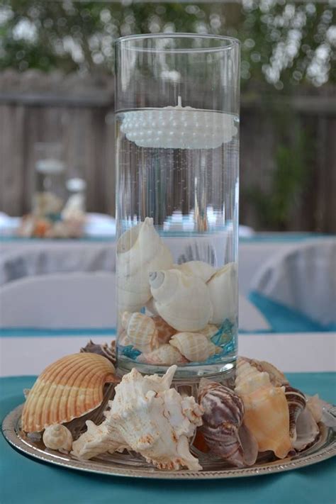 Sand petal weddings offers the convenient rental service of beach style centerpieces for ease to the traveling destination bride. beach theme quinceanera center pieces | Beach theme ...