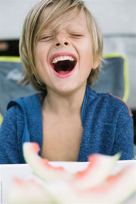 Contrary to popular belief, hairstyles for long blonde hair needn't be over complicated. Young Boy With Long Blonde Hair Laughing With Open Mouth ...