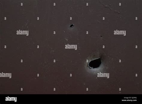 Shrapnel Scars On Metal Plate Stock Photo Alamy