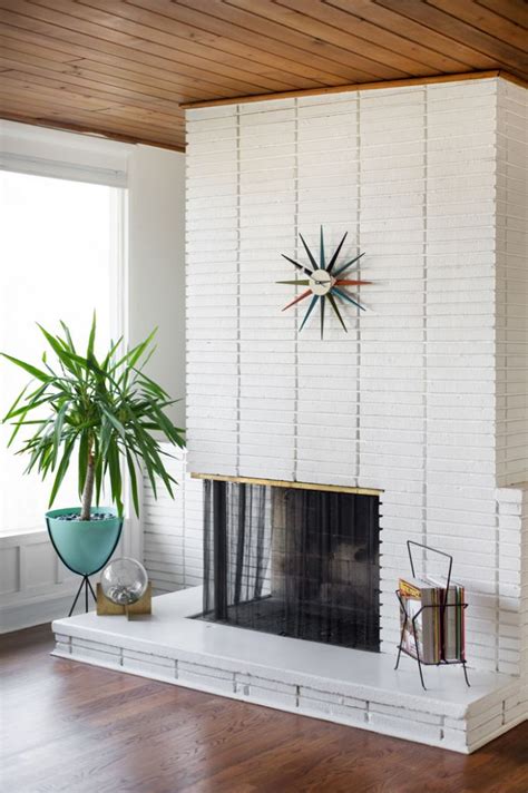 Brick fireplace update using cement and aged wood mantel. Curating Authentic Mid Century Furnishings at Home - Home