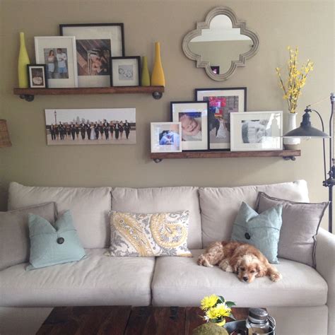 So we can divide the room in two. Family room wall collage above the couch. Shelves from ...