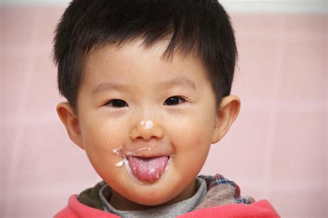 After three kidnappers lose the baby they have kidnapped, both the cops and kidnappers go looking for the baby. Asian Child, Tongue Out Royalty Free Stock Photography - Image: 13732687