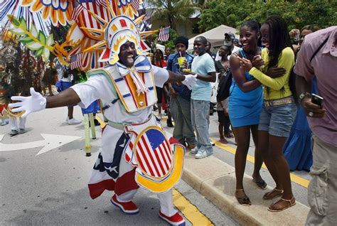 People Enjoy The Junkanoo Parade As A Dancer Passes By At The Goombay Festival On June 6 2009
