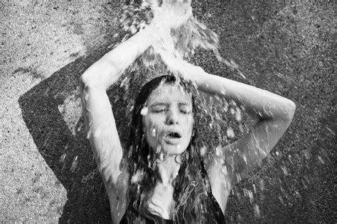 Girl Under The Waterfall — Stock Photo © Radarani 128465766