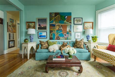 If you like the idea of going this shade of green. Bright teal blue living room walls and tufted sofa with ...