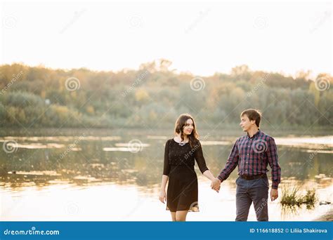 Beautiful Couple At Sunset Near The River Stock Photo Image Of Beauty