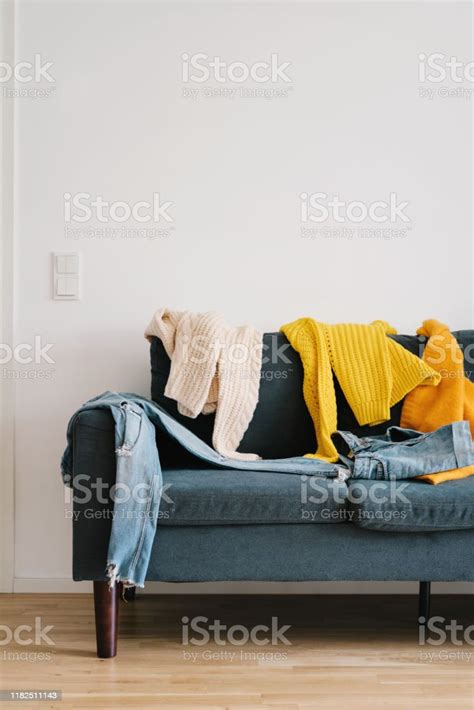 Messy Clothes On The Couch Stock Photo Download Image Now Living