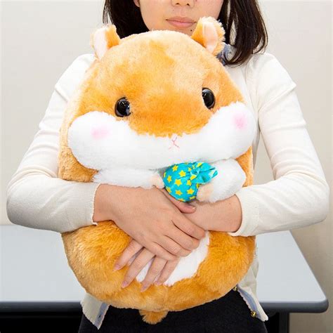 A Woman Holding A Stuffed Animal In Her Arms