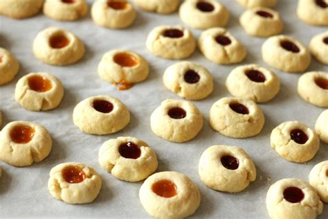 Roll 1 teaspoon dough into ball and dip into beaten egg white, roll in chopped nuts. Traditional Austrian Linzer Cookies & Jam Thumbprints ...