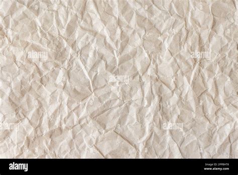 Recycled Crumpled Beige Paper Texture Background Wrinkled And Creased