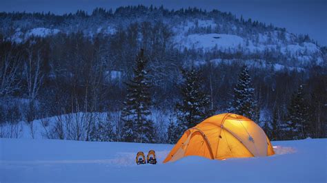 Camping In Snow Field In Mountains Covered With Snow