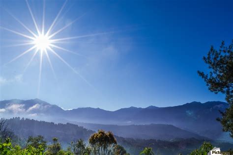 The direct rays, light or warmth of the sun. Early Morning Sunshine Mount Latimojong Indonesia - Travenesia