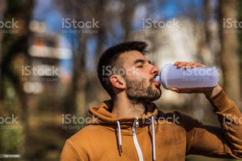 Fitness Man Drinking Water From Bottle Thirsty Athlete Having Cold