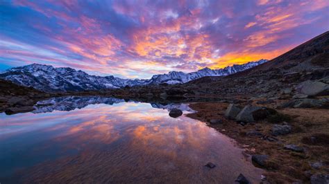 Alpine Lake In Italian Alps Colorful Sky Sunset Snow