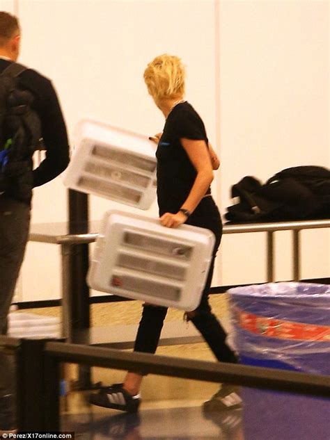 Kristen Stewart Pushes Her Own Luggage Through Security At Lax Airport