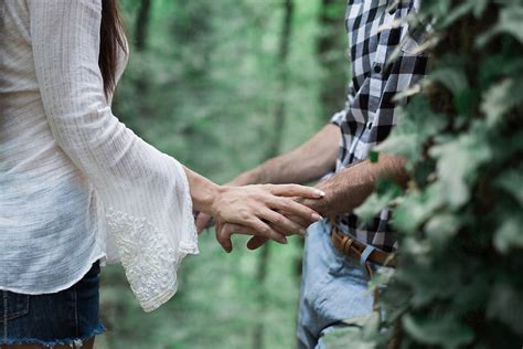 Close Up Of A Couple Holding Hands By Stocksy Contributor Mosuno Stocksy