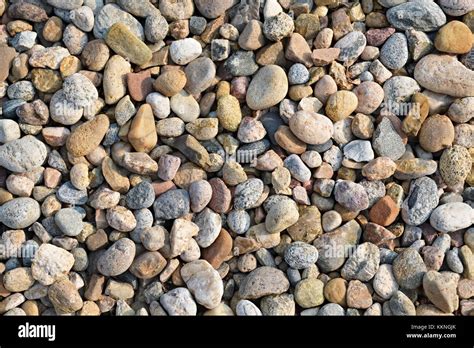 Background Of Small Multi Colored River Rock Stone Texture Stock Photo