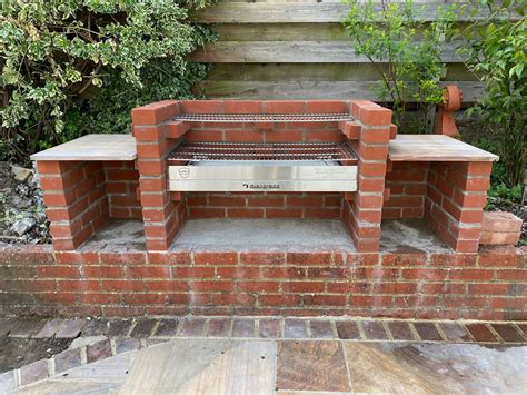 A Brick Oven Sitting On Top Of A Patio