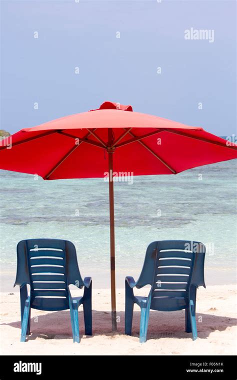 Two Chairs And Umbrella On Stunning Tropical Beach In Morrocoy National