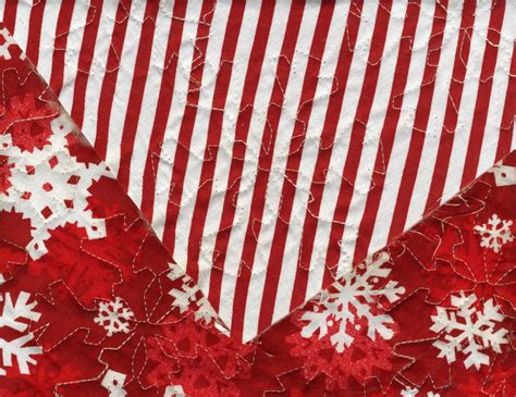 Double Faced Christmas Snowflake Prequilted Fabric Sold By