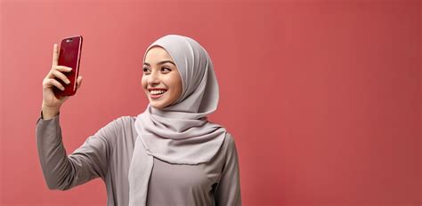Premium Ai Image A Malay Muslim Woman Wearing A Hijab Taking A Selfie With Copy Space