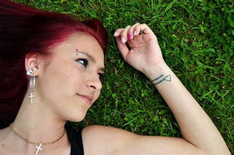 Girl With Red Hair Lies On Green Grass Free Image Download