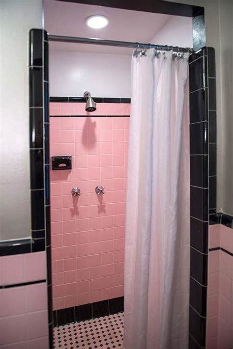 If done right, pink tile can provide a classy, vintage feel. Robert's pink and black bathroom makeover | Retro ...